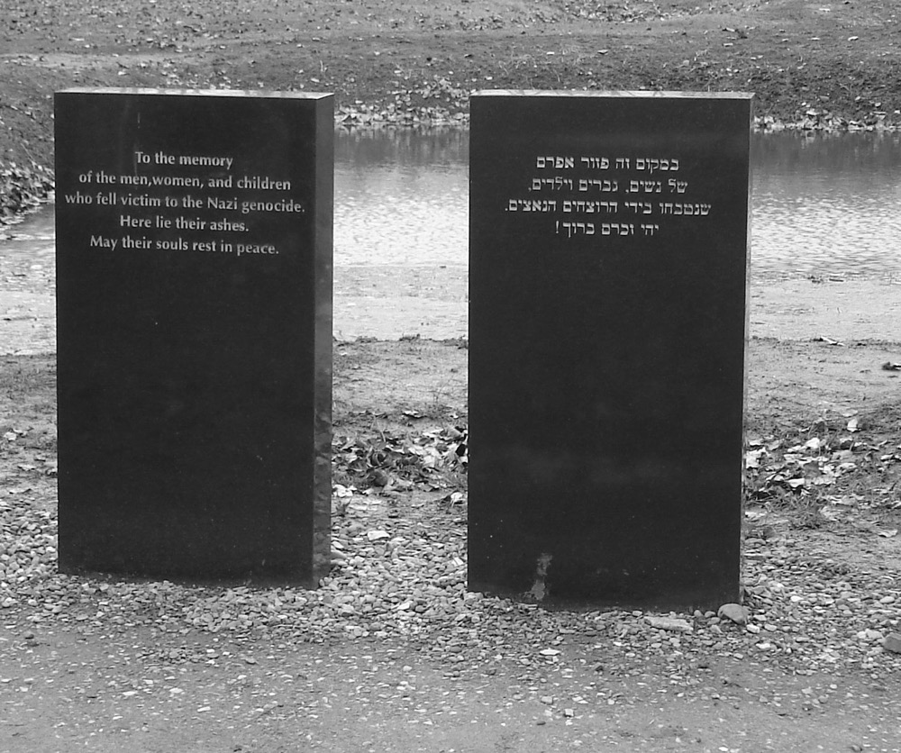 KL Auschwitz II-Birkenau: A memorial next to a pit of ashes from the crematoria.